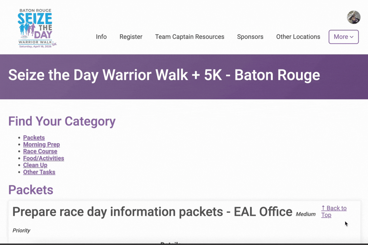 A webpage for ‘Seize the Day Warrior Walk + 5K – Baton Rouge’ with a purple theme. At the top left is the Baton Rouge Seize the Day Warrior Walk + 5K logo; along the top navigation are links such as Info, Register, Team Captain Resources, Sponsors, Other Locations, and a More dropdown on the right, plus a small circular user/profile icon.  Below a wide purple header banner with the event name, the page shows a section titled ‘Find Your Category’ with a bulleted list of anchor links: Packets, Morning Prep, Race Course, Food/Activities, Clean Up, and Other Tasks.  Farther down, a large heading ‘Packets’ appears, followed by a task card/section titled ‘Prepare race day information packets – EAL Office’ with a Medium label to the right and a Back to Top link. A mouse cursor is visible near the right side of the content.